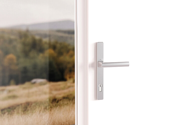 Silver Roto Square entrance door handle on an white PVC entrance door from inside